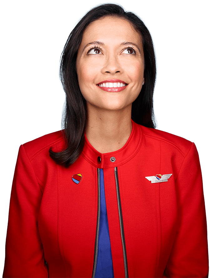 a smirking Southwest Airlines employee looking up
