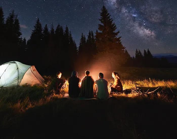 People sitting around a campfire